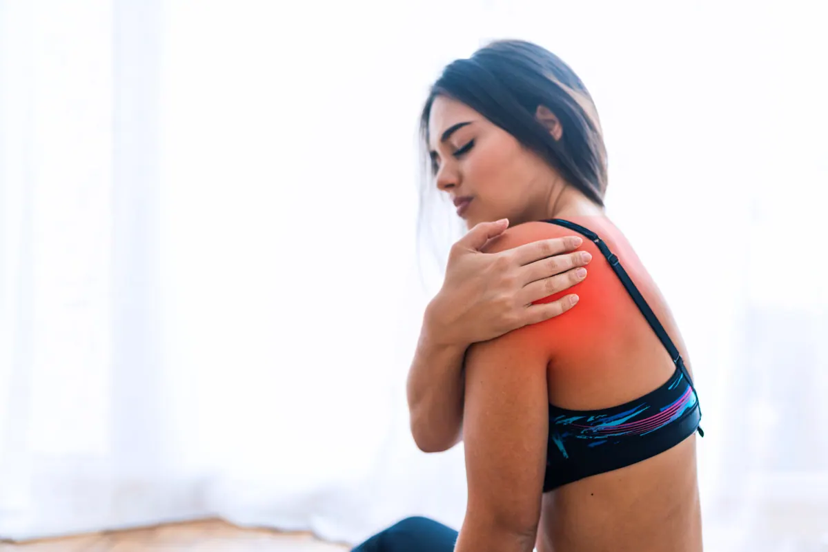 woman suffering shoulder pain