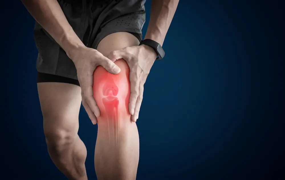 athlete man in knee pain due to overuse